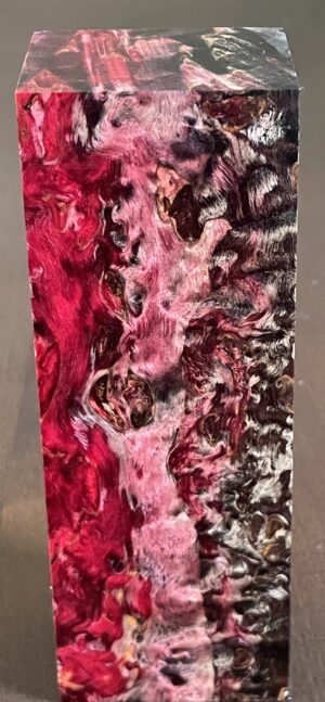 Stabilized and dyed Masur birch wood. Dimensions: 29x40x147mm