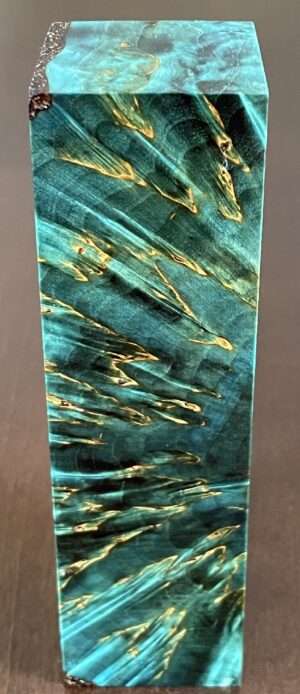 Stabilized and dyed Masur birch cross cut wood. Dimensions: 35x36x138mm